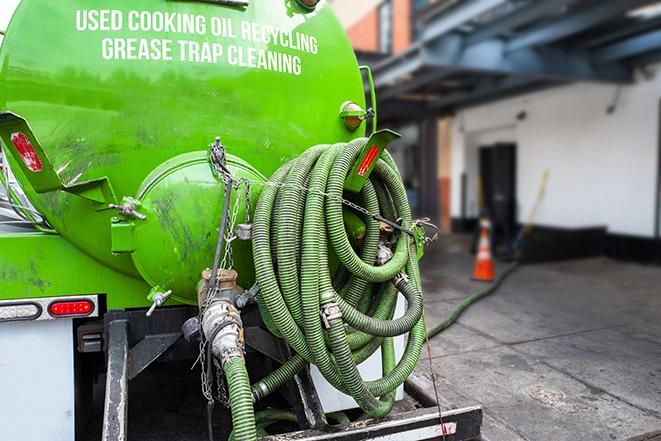 a vacuum truck pumping out a large underground grease trap in Benicia, CA